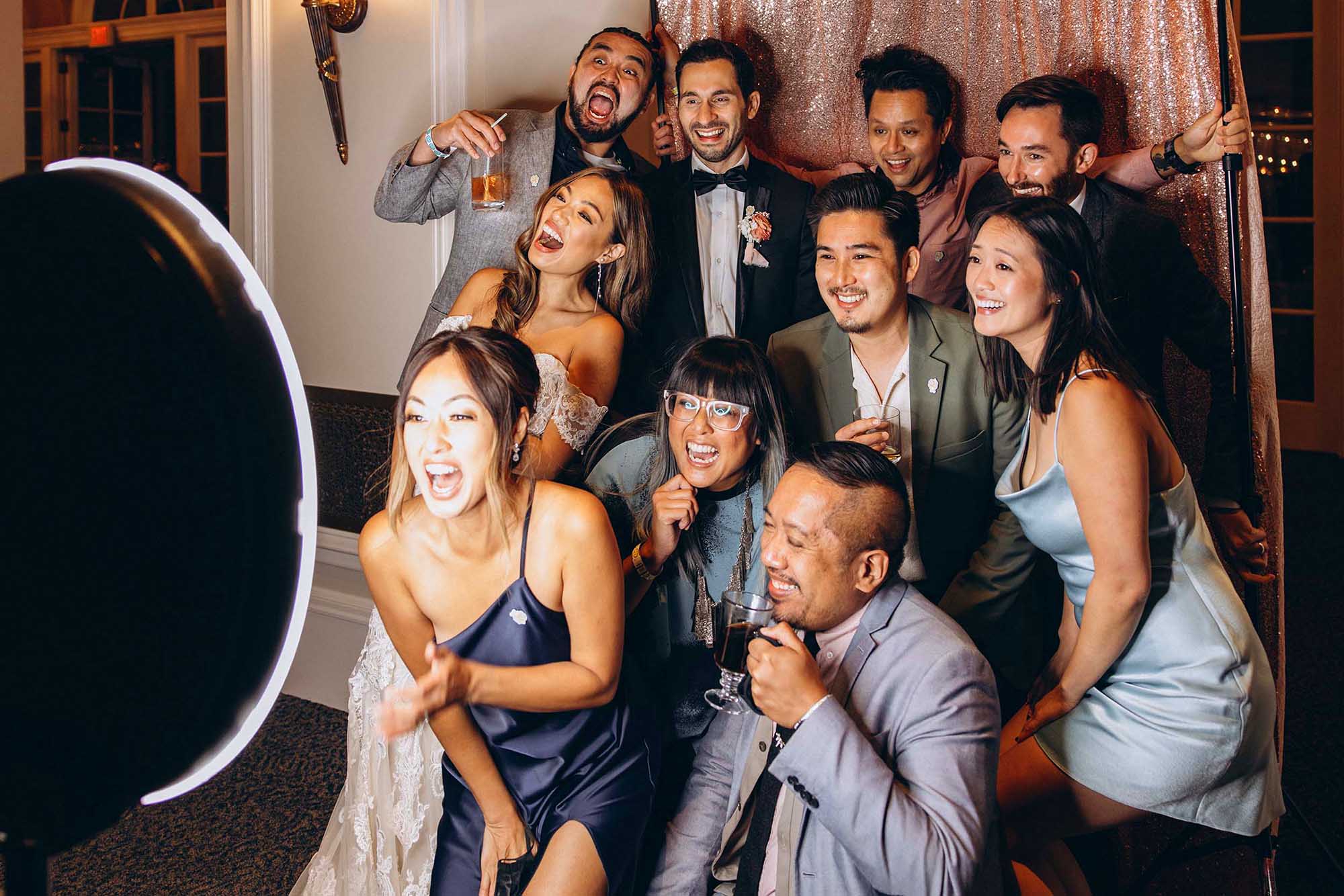Wedding guests having fun with photo booth